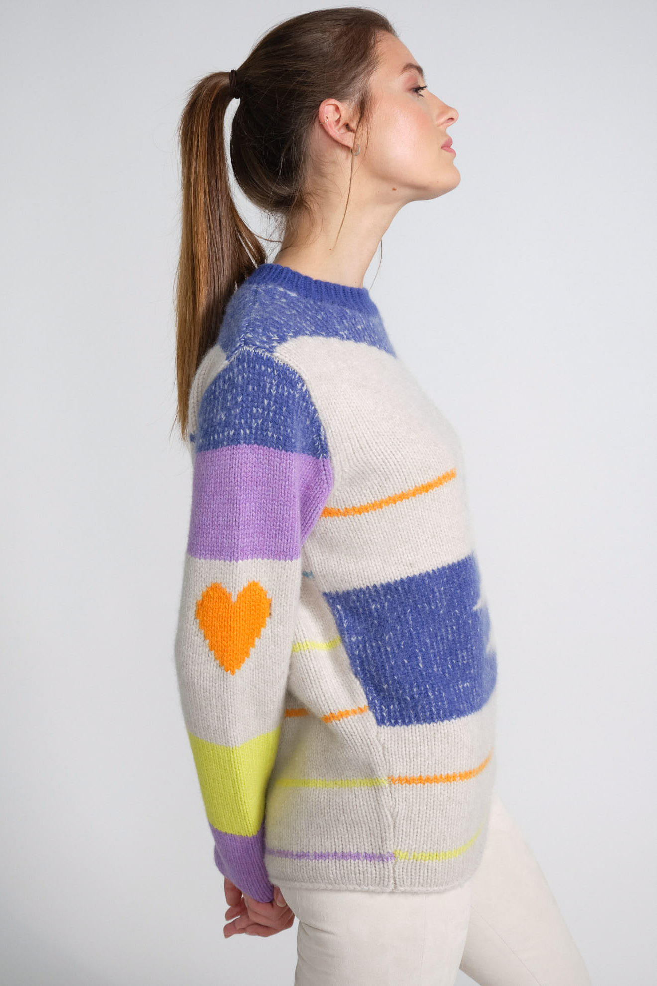 the elder statesman knit love stripes white blue yellow orange details outfit the elder statesman sweater white blue orange yellow details cashmere model side