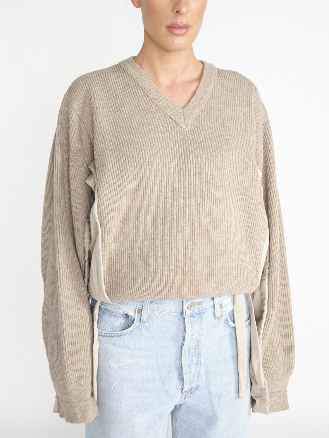 Woven sweater with curved sleeves 