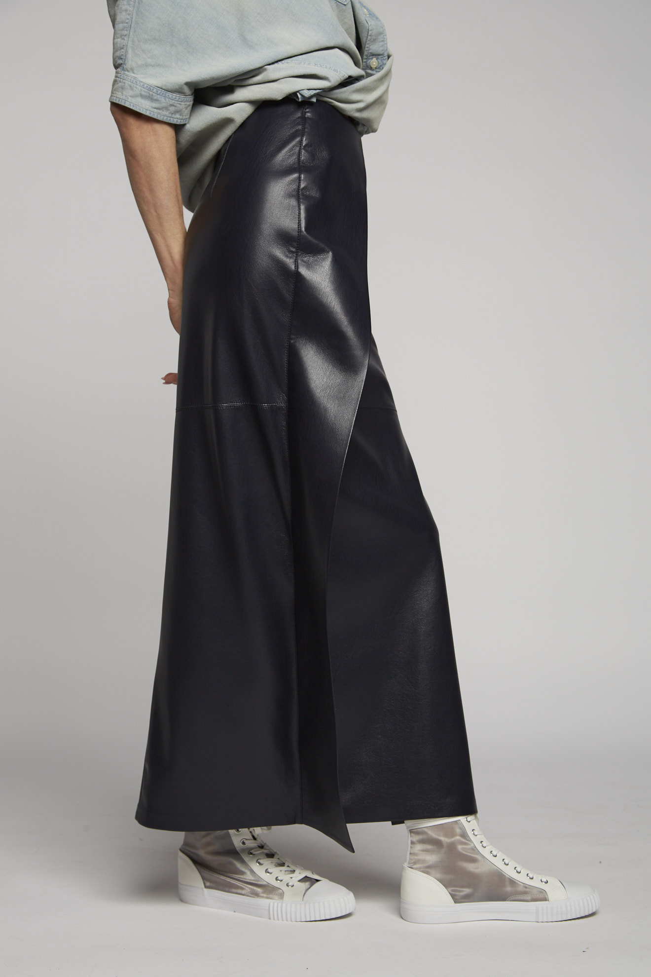 nanushka skirt black plain vegan leather model side